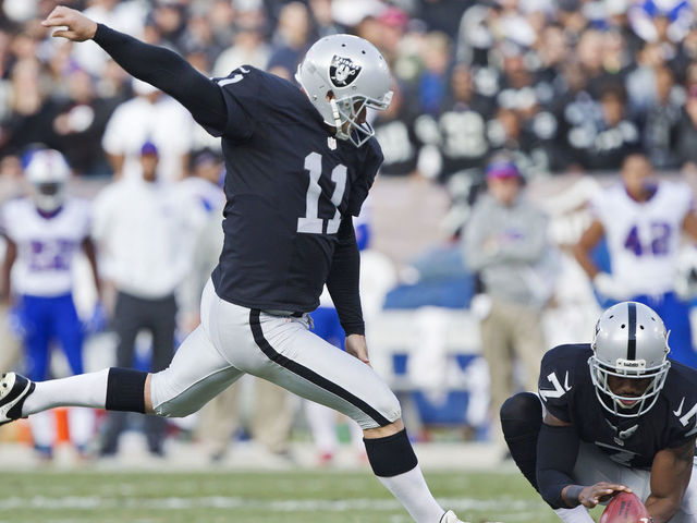 OAKLAND, CA - DECEMBER 4: Kicker Sebastian Janikowski #11 of the Oakland Raiders scores a point after touchdown against the Buffalo Bills on December 4, 2016 at Oakland-Alameda County Coliseum in Oakland, California. The Raiders won 38-24.