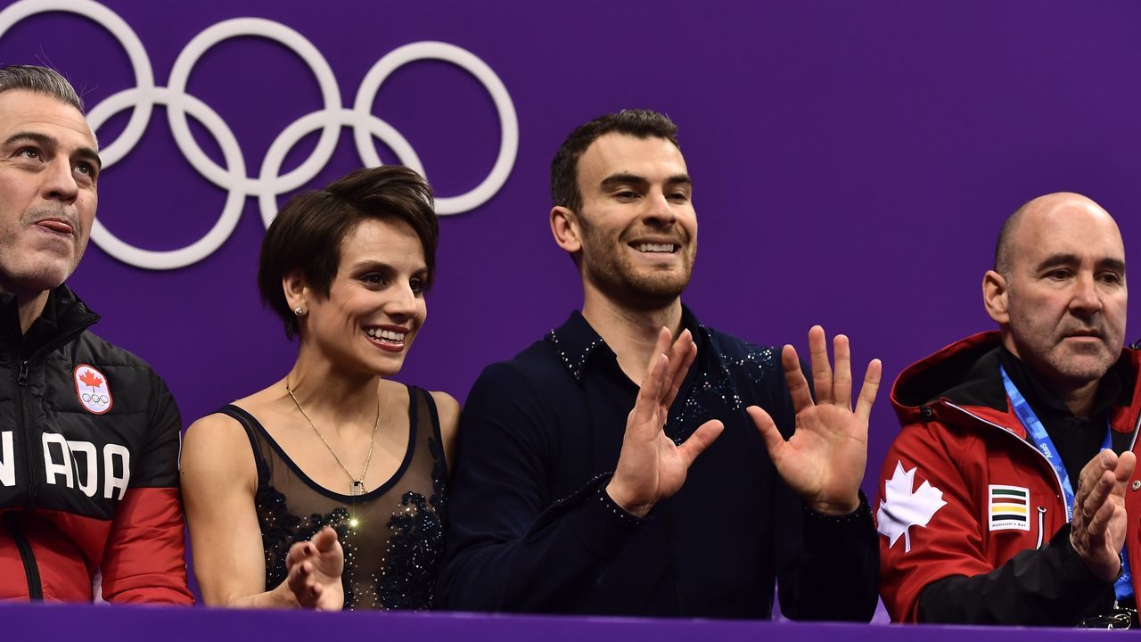 Canada's Meagan Duhamel and Canada's Eric Radford react after competing in the pair skating short program of the figure skating event during the Pyeongchang 2018 Winter Olympic Games at the Gangneung Ice Arena in Gangneung on February 14, 2018. / AFP PHOTO / ARIS MESSINIS