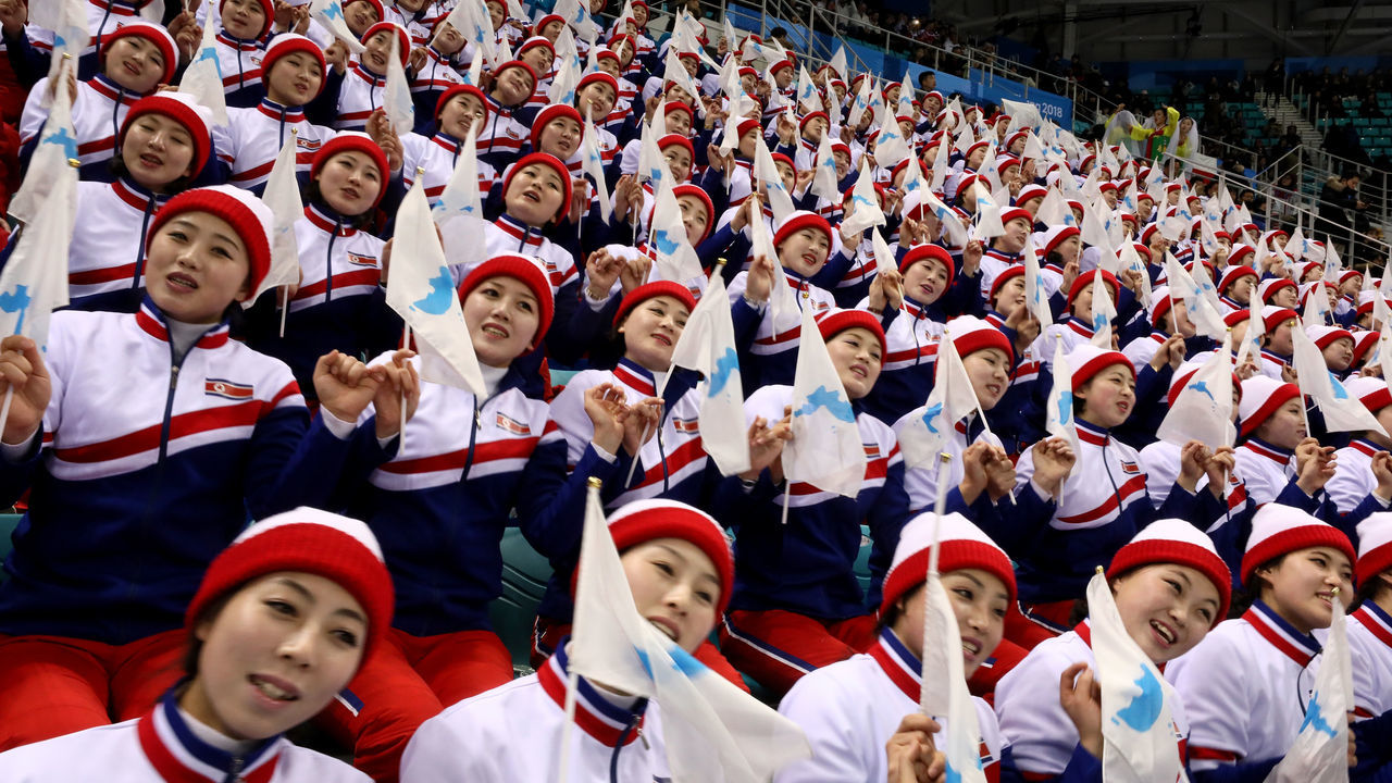 GANGNEUNG, SOUTH KOREA - FEBRUARY 15: North Korean cheerleaders sing prior to the Men's Ice Hockey Preliminary Round Group A game between Czech Republic and Republic of Korea on day six of the PyeongChang 2018 Winter Olympic Games at Gangneung Hockey Centre on February 15, 2018 in Gangneung, South Korea.