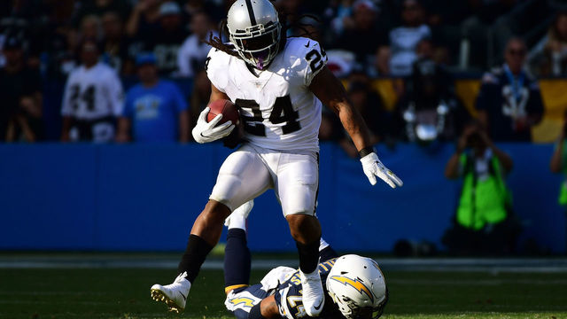 CARSON, CA - DECEMBER 31: Marshawn Lynch #24 of the Oakland Raiders breaks free from Trevor Williams #24 of the Los Angeles Chargers during the second quarter of the game at StubHub Center on December 31, 2017 in Carson, California.