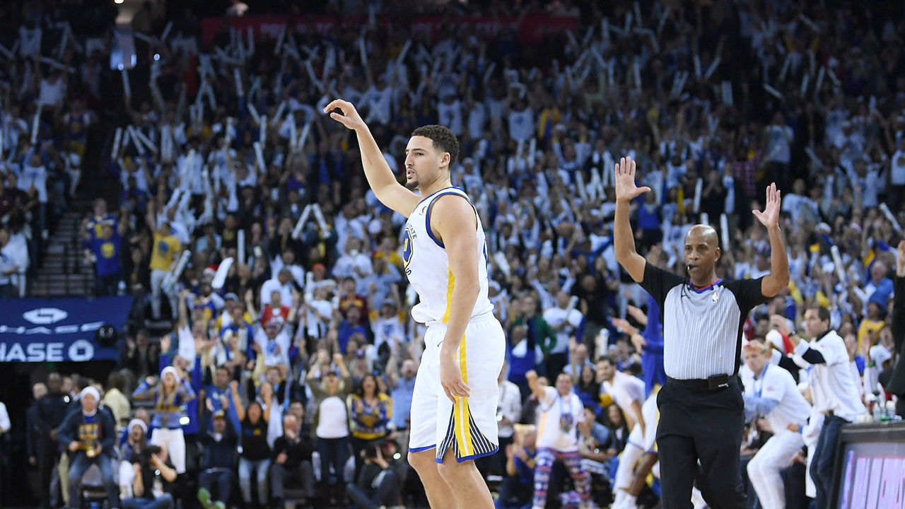 OAKLAND, CA - DECEMBER 25: Klay Thompson #11 of the Golden State Warriors reacts after making a three-point shot against the Cleveland Cavaliers during an NBA basketball game at ORACLE Arena on December 25, 2017 in Oakland, California.