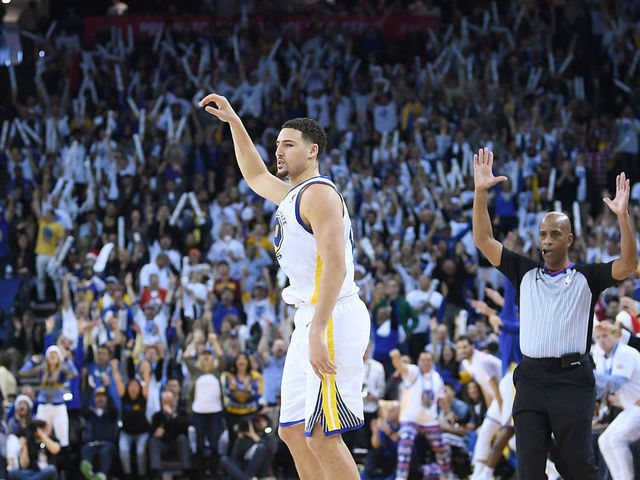 OAKLAND, CA - DECEMBER 25: Klay Thompson #11 of the Golden State Warriors reacts after making a three-point shot against the Cleveland Cavaliers during an NBA basketball game at ORACLE Arena on December 25, 2017 in Oakland, California.