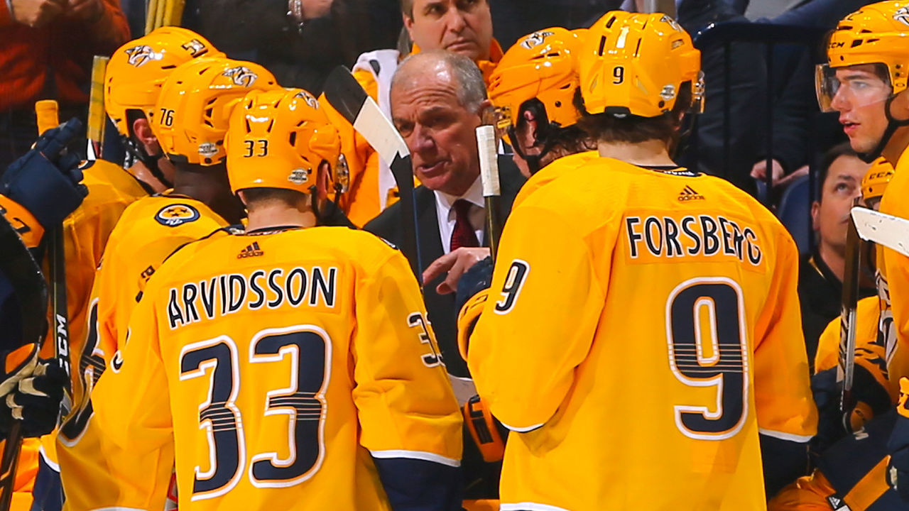 NASHVILLE, TN - FEBRUARY 15: Nashville Predators assistant coach Kevin McCarthy speaks to Viktor Arvidsson #33 and Filip Forsberg #9 during a time out against of the Calgary Flames during the third period at Bridgestone Arena on February 15, 2018 in Nashville, Tennessee.