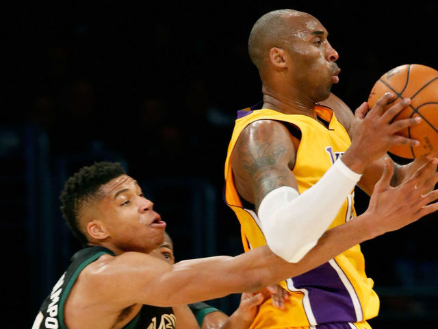LOS ANGELES, CA - DECEMBER 15: Kobe Bryant #24 of the Los Angeles Lakers dribbles past Giannis Antetokounmpo #34 of the Milwaukee Bucks during the second half of a game at Staples Center on December 15, 2015 in Los Angeles, California.