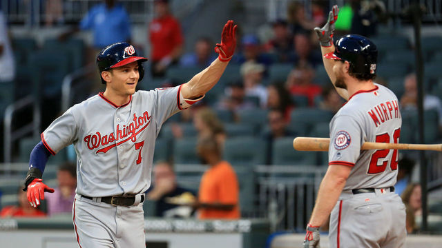 ATLANTA, GA - SEPTEMBER 20: Trea Turner #7 celebrates a home run with Daniel Murphy #20 of the Washington Nationals during the first inning against the Atlanta Braves at SunTrust Park on September 20, 2017 in Atlanta, Georgia.