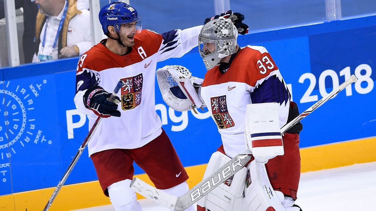 Czech Republic's Jan Kolar (L) and Czech Republic's Pavel Francouz celebrate their win in the men's preliminary round ice hockey match between Canada and Czech Republic during the Pyeongchang 2018 Winter Olympic Games at the Gangneung Hockey Centre in Gangneung on February 17, 2018. / AFP PHOTO / Brendan Smialowski