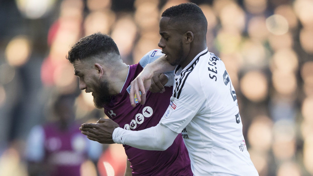 Fulham's Ryan Sessegnon tries to tackle Aston Villa's Robert Snodgrass during the Sky Bet Championship match at Craven Cottage, London.