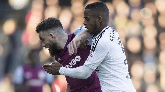 Fulham's Ryan Sessegnon tries to tackle Aston Villa's Robert Snodgrass during the Sky Bet Championship match at Craven Cottage, London.