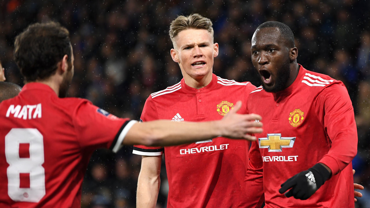 HUDDERSFIELD, ENGLAND - FEBRUARY 17: Romelu Lukaku celebrates with teammates Juan Mata and Scott McTominay after scoring his sides first goal during the The Emirates FA Cup Fifth Round between Huddersfield Town v Manchester United on February 17, 2018 in Huddersfield, United Kingdom.