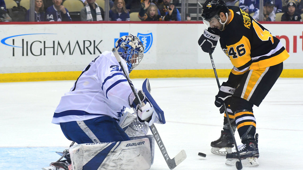 PITTSBURGH, PA - FEBRUARY 17: Zach Aston-Reese #46 of the Pittsburgh Penguins drives with the puck against Frederik Andersen #31 of the Toronto Maple Leafs at PPG PAINTS Arena on February 17, 2018 in Pittsburgh, Pennsylvania.
