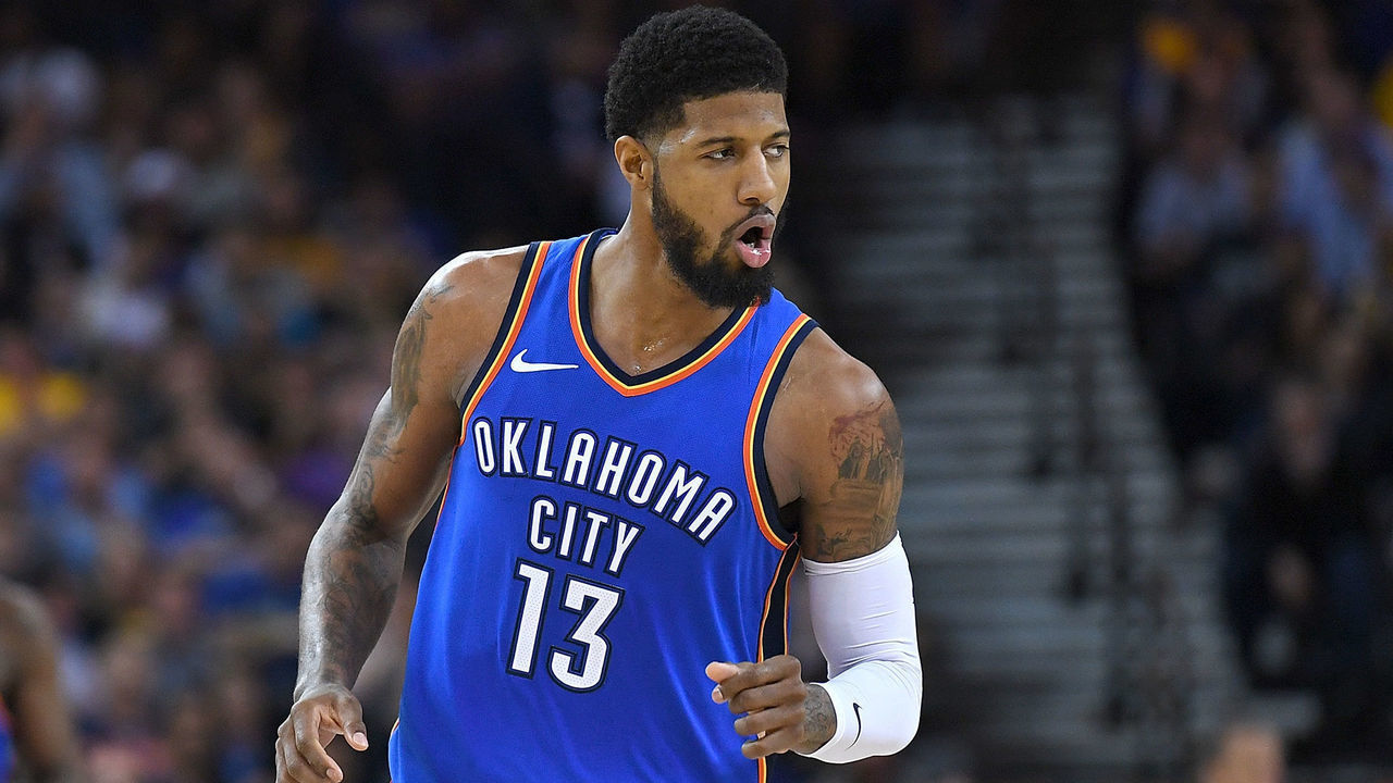 OAKLAND, CA - FEBRUARY 06: Paul George #13 of the Oklahoma City Thunder reacts after making a three-point shot over Kevin Durant #35 of the Golden State Warriors during the second half of their NBA basketball game at ORACLE Arena on February 6, 2018 in Oakland, California.