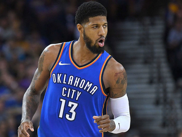 OAKLAND, CA - FEBRUARY 06: Paul George #13 of the Oklahoma City Thunder reacts after making a three-point shot over Kevin Durant #35 of the Golden State Warriors during the second half of their NBA basketball game at ORACLE Arena on February 6, 2018 in Oakland, California.