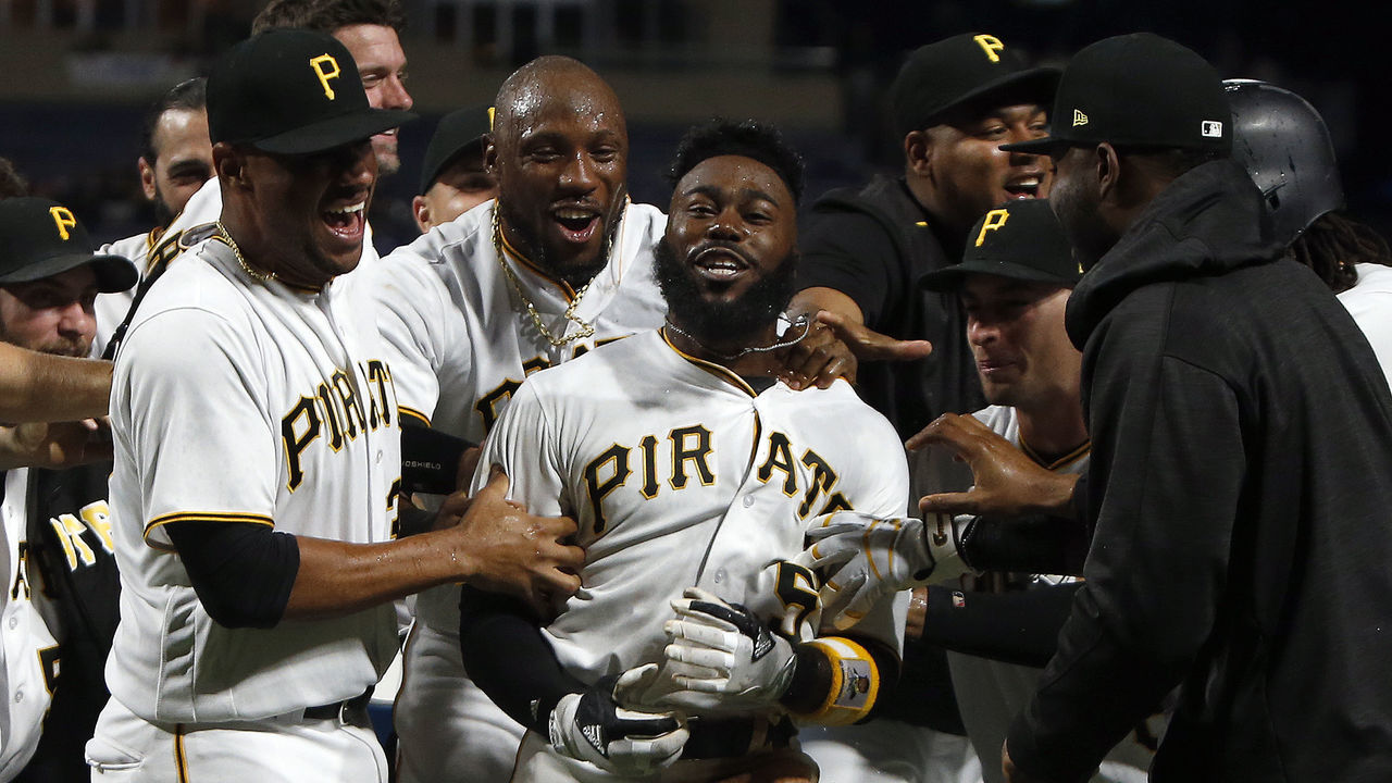 PITTSBURGH, PA - AUGUST 23: Josh Harrison #5 of the Pittsburgh Pirates celebrates with teammates after hitting a walk off home run in the tenth inning breaking up a no hitter against the Los Angeles Dodgers in the at PNC Park on August 23, 2017 in Pittsburgh, Pennsylvania.