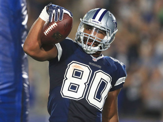 LOS ANGELES, CA - AUGUST 12: Rico Gathers #80 of the Dallas Cowboys celebrates after scoring a touchdown making the score 10-10 during the preseason game against the Los Angeles Rams at Los Angeles Memorial Coliseum on August 12, 2017 in Los Angeles, California.