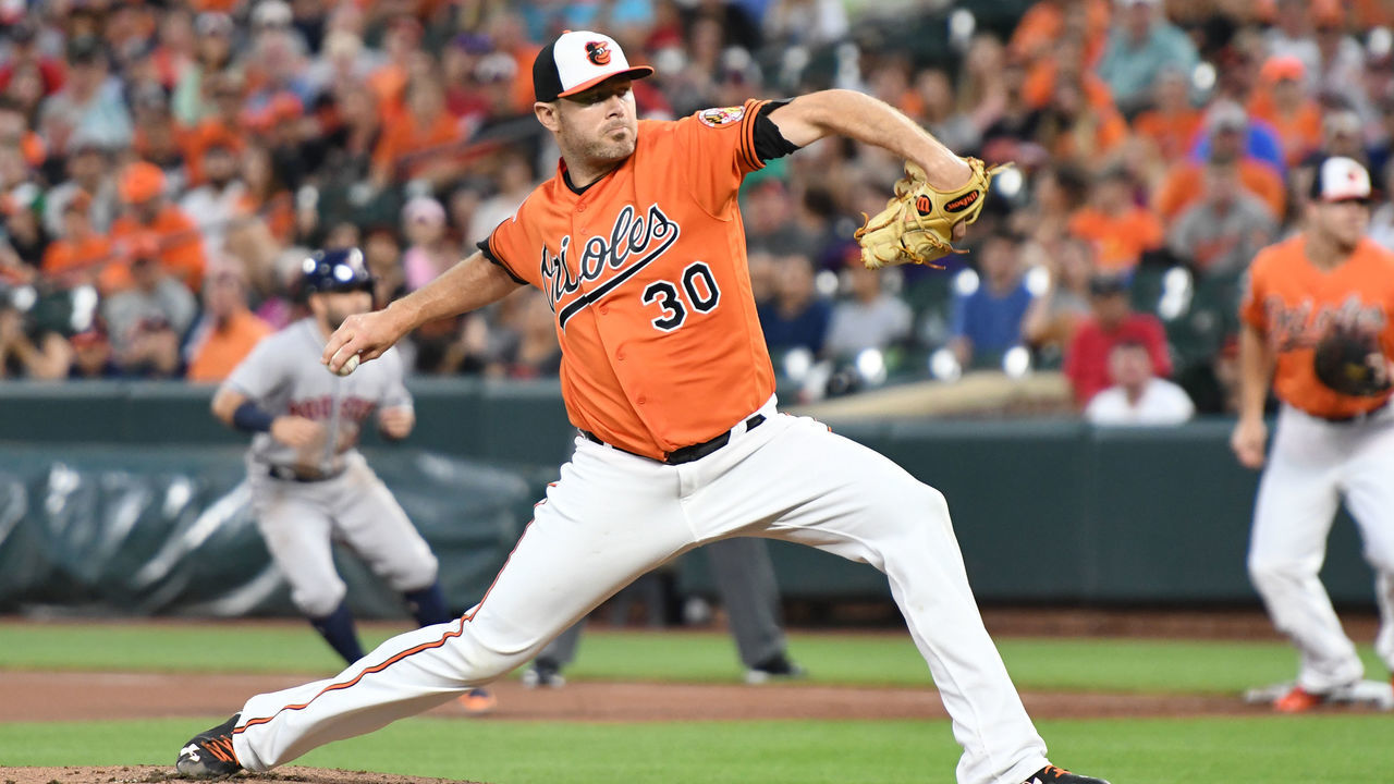BALTIMORE, MD - JULY 22: Chris Tillman #30 of the Baltimore Orioles pitches in the first inning during a baseball game against the Houston Astros at Oriole Park at Camden Yards on July 22, 2017 in Baltimore, Maryland.