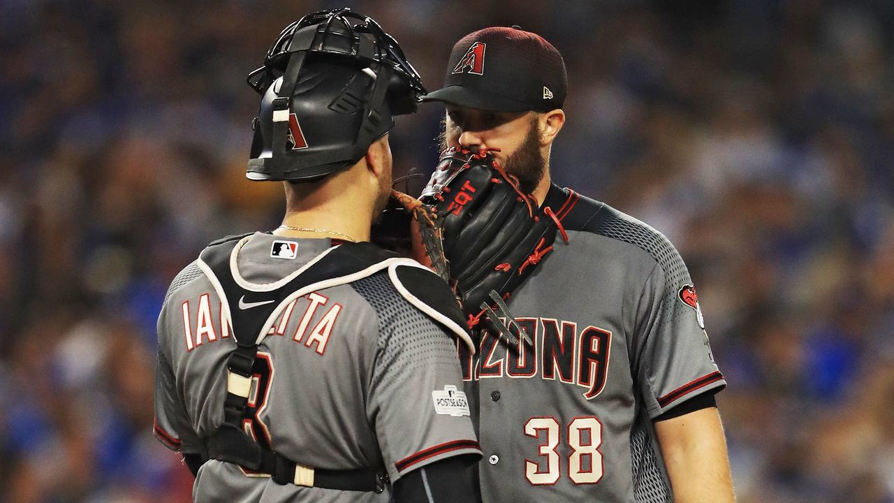 LOS ANGELES, CA - OCTOBER 07: Chris Iannetta #8 visits Robbie Ray #38 of the Arizona Diamondbacks on the mound against the Los Angeles Dodgers in game two of the National League Division Series at Dodger Stadium on October 7, 2017 in Los Angeles, California.