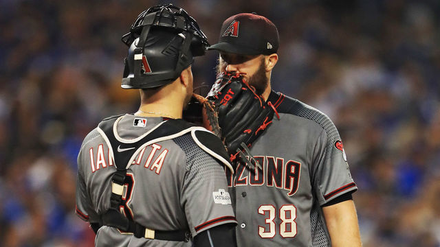 LOS ANGELES, CA - OCTOBER 07: Chris Iannetta #8 visits Robbie Ray #38 of the Arizona Diamondbacks on the mound against the Los Angeles Dodgers in game two of the National League Division Series at Dodger Stadium on October 7, 2017 in Los Angeles, California.