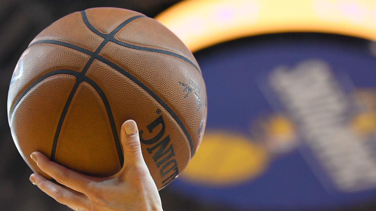 OAKLAND, CA - FEBRUARY 06: A detailed view ot the official Spalding NBA basketball held in the air by referee Lauren Holtkamp #7 during an NBA basketball game between the Oklahoma City Thunder and Golden State Warriors at ORACLE Arena on February 6, 2018 in Oakland, California.