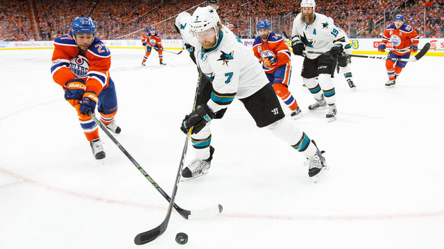 EDMONTON, AB - APRIL 20: Milan Lucic #27 of the Edmonton Oilers battles against Paul Martin #7 of the San Jose Sharks in Game Five of the Western Conference First Round during the 2017 NHL Stanley Cup Playoffs at Rogers Place on April 20, 2017 in Edmonton, Alberta, Canada.