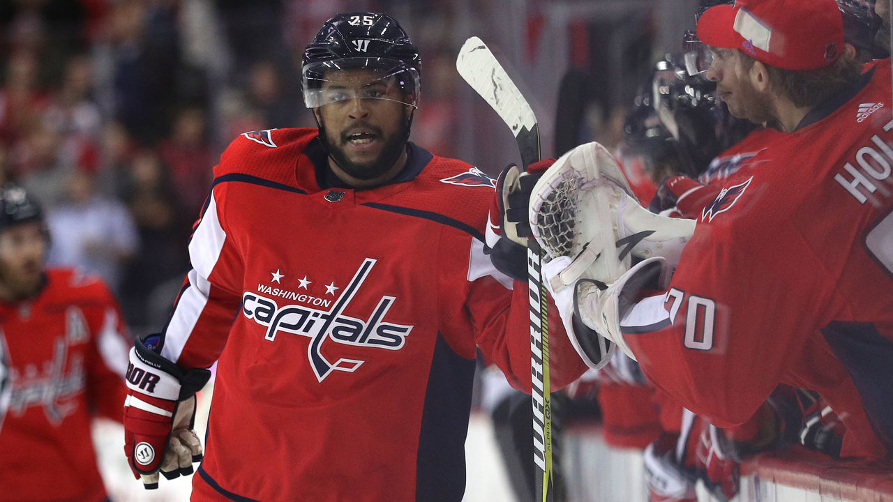 WASHINGTON, DC - DECEMBER 04: Devante Smith-Pelly #25 of the Washington Capitals celebrates with teammates after scoring a goal against the San Jose Sharks during the first period at Capital One Arena on December 4, 2017 in Washington, DC.