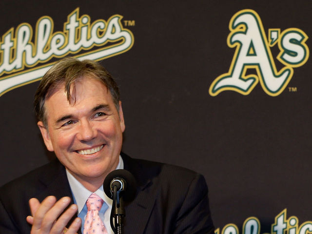 OAKLAND, CA - DECEMBER 18: Oakland Athletics vice president and general manager Billy Beane and Hiroyuki Nakajima of Japan joke with each other at a press conference where Beane introduced Nakajima to the Oakland Athletics at the O.co Coliseum on December 18, 2012 in Oakland, California. Nakajima signed a two-year contract through 2014 with a club option for 2015.
