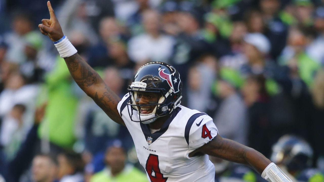 SEATTLE, WA - OCTOBER 29: Quarterback Deshaun Watson #4 of the Houston Texans cheers as DeAndre Hopkins #10 scores a 72 yard touchdown against the Seattle Seahawks in the fourth quarter at CenturyLink Field on October 29, 2017 in Seattle, Washington.