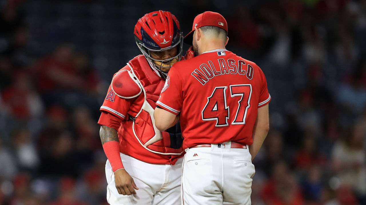 ANAHEIM, CA - SEPTEMBER 20: Martin Maldonado #12 talks with Ricky Nolasco #47 of the Los Angeles Angels of Anaheim during the second inning of a game against the Cleveland Indians at Angel Stadium of Anaheim on September 20, 2017 in Anaheim, California.