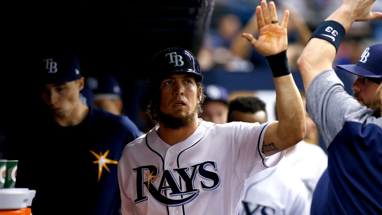 ST. PETERSBURG, FL - MAY 9: Colby Rasmus #28 of the Tampa Bay Rays celebrates in the dugout with teammate Derek Norris #33 after scoring off of an RBI single by Tim Beckham #1 during the fifth inning of a game against the Kansas City Royals on May 9, 2017 at Tropicana Field in St. Petersburg, Florida.
