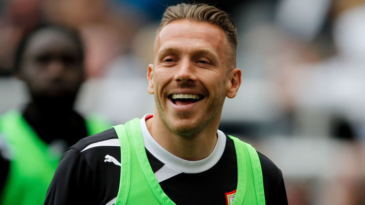 NEWCASTLE, ENGLAND- May 03: Cardiff City's Craig Bellamy of Cardiff shares a joke with Newcastle fans during the Barclays Premier League match between Newcastle United and Cardiff City at St. James' Park on May 03, 2014 in Newcastle upon Tyne, England.