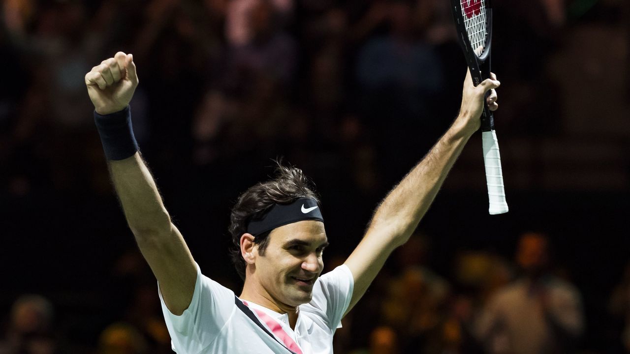 TOPSHOT - Roger Federer of Switzerland celebrates after victory against Grigor Dimitrov of Bulgaria during their men's singles final for the ABN AMRO World Tennis Tournament in Rotterdam on February 18, 2018. / AFP PHOTO / ANP / Koen Suyk / Netherlands OUT