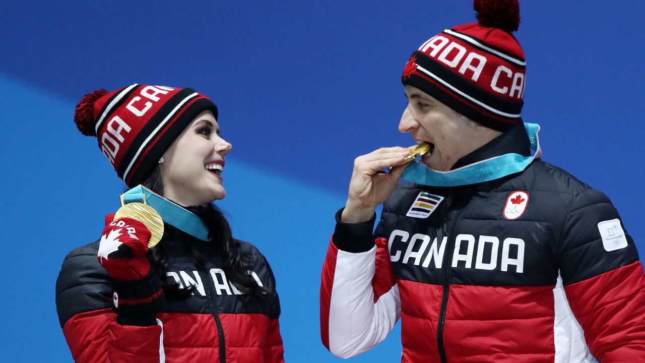 PYEONGCHANG-GUN, SOUTH KOREA - FEBRUARY 20: Gold medalists Tessa Virtue and Scott Moir of Canada celebrate during the medal ceremony for Figure Skating - Ice Dance Free Dance on day 11 of the PyeongChang 2018 Winter Olympic Games at Medal Plaza on February 20, 2018 in Pyeongchang-gun, South Korea.