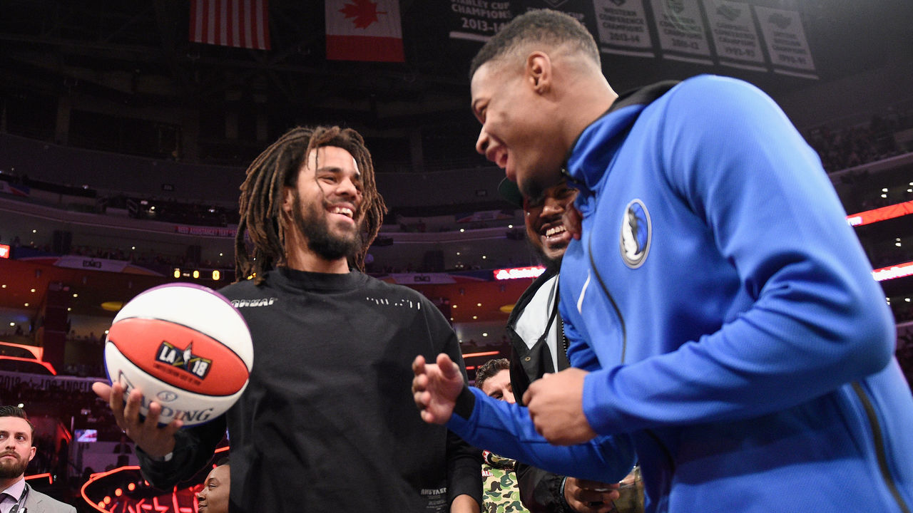 LOS ANGELES, CA - FEBRUARY 17: J. Cole and Dennis Smith Jr. attend the 2018 Verizon Slam Dunk Contest at Staples Center on February 17, 2018 in Los Angeles, California.