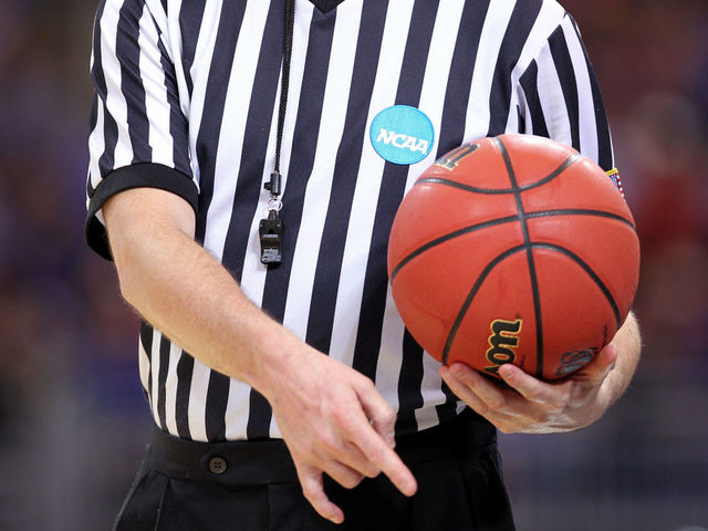 ST. LOUIS, MO - MARCH 23: : : A detail of an NCAA referee holding an official wilson NCAA tournament basketball as the North Carolina State Wolfpack play against the Kansas Jayhawks during the 2012 NCAA Men's Basketball Midwest Regional Semifinal at Edward Jones Dome on March 23, 2012 in St. Louis, Missouri.