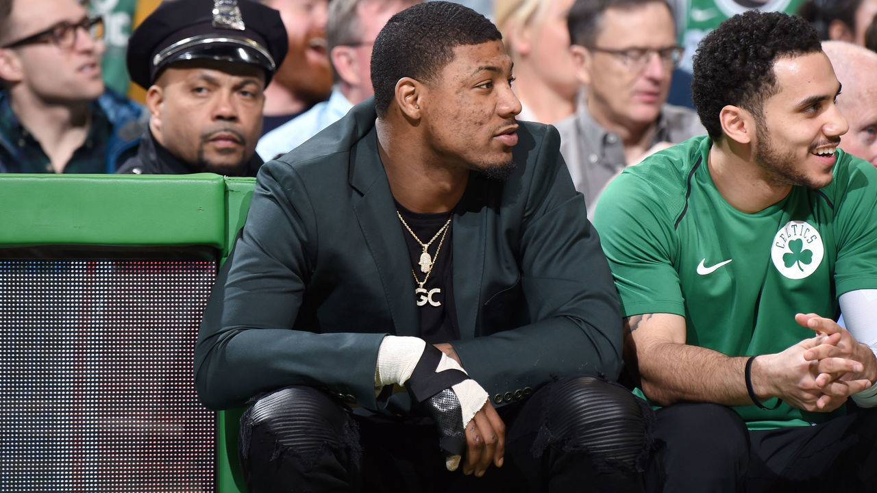 BOSTON, MA - JANUARY 31: Marcus Smart #36 of the Boston Celtics sits courtside during the game against the New York Knicks on January 31, 2018 at the TD Garden in Boston, Massachusetts. Mandatory Copyright Notice: Copyright 2018 NBAE