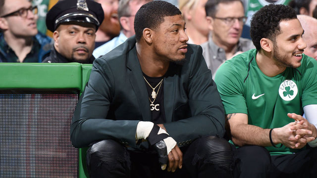 BOSTON, MA - JANUARY 31: Marcus Smart #36 of the Boston Celtics sits courtside during the game against the New York Knicks on January 31, 2018 at the TD Garden in Boston, Massachusetts. Mandatory Copyright Notice: Copyright 2018 NBAE