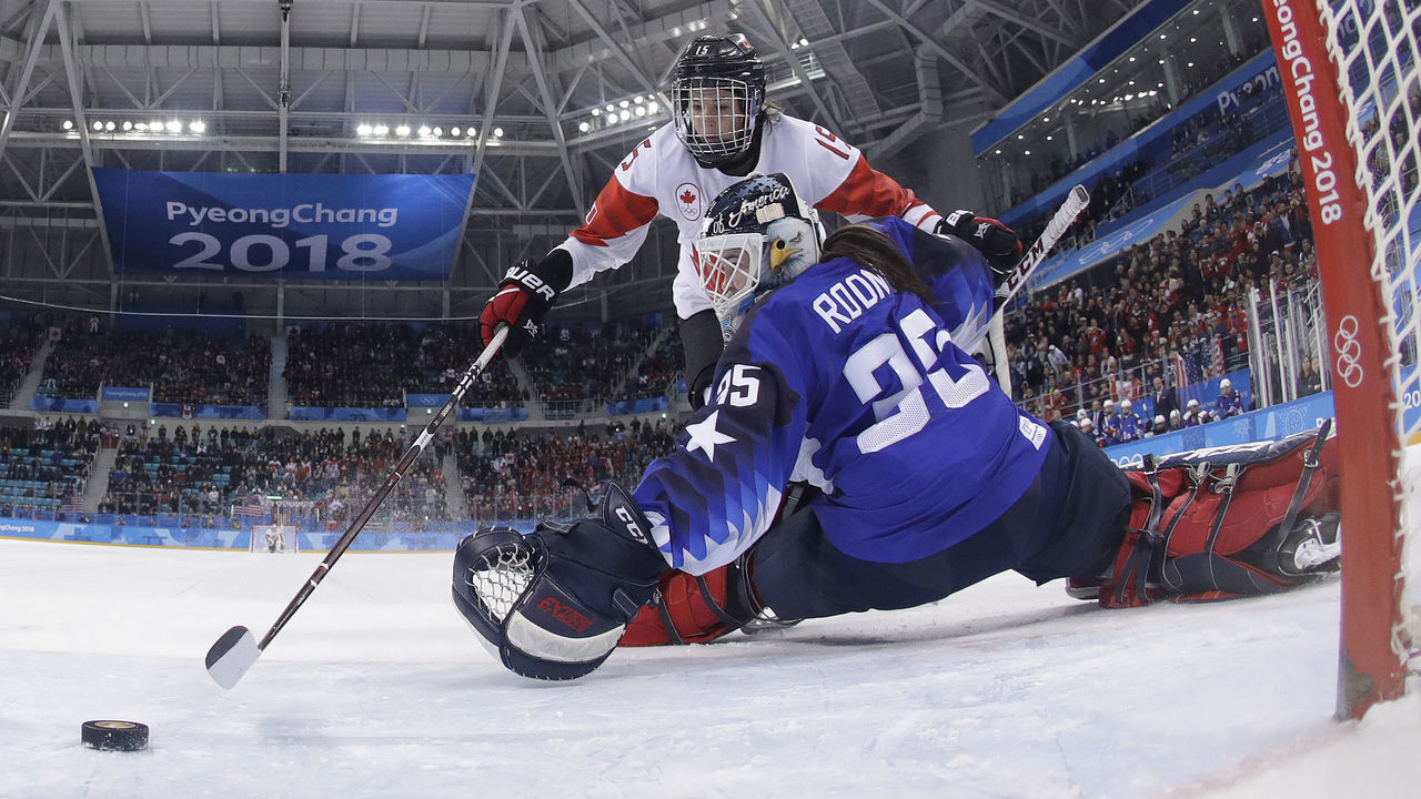 GANGNEUNG, SOUTH KOREA - FEBRUARY 22: Melodie Daoust (15), of Canada, scores a goal against goalie Maddie Rooney (35), of the United States, in the penalty shootout during the Women's Gold Medal Game against Canada on day thirteen of the PyeongChang 2018 Winter Olympic Games at Gangneung Hockey Centre on February 22, 2018 in Gangneung, South Korea.