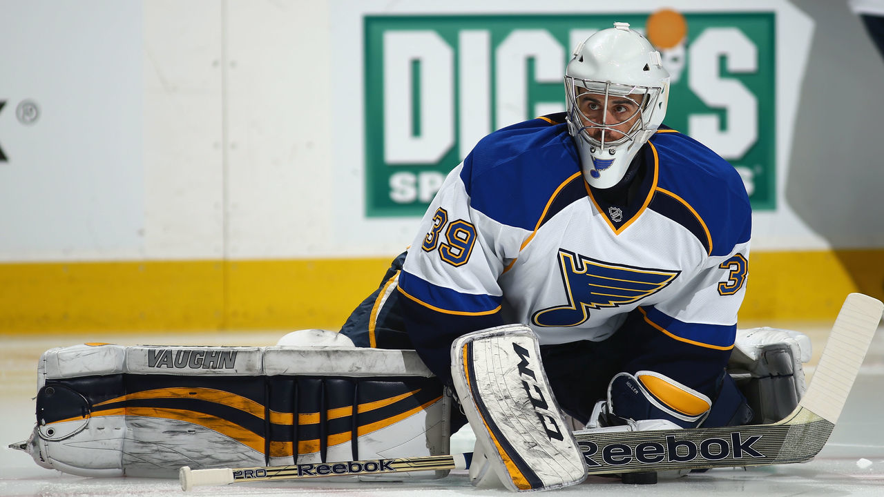 DENVER, CO - MARCH 08: Goalie Ryan Miller #39 of the St. Louis Blues stretches during warm ups prior to facing the Colorado Avalanche at Pepsi Center on March 8, 2014 in Denver, Colorado.