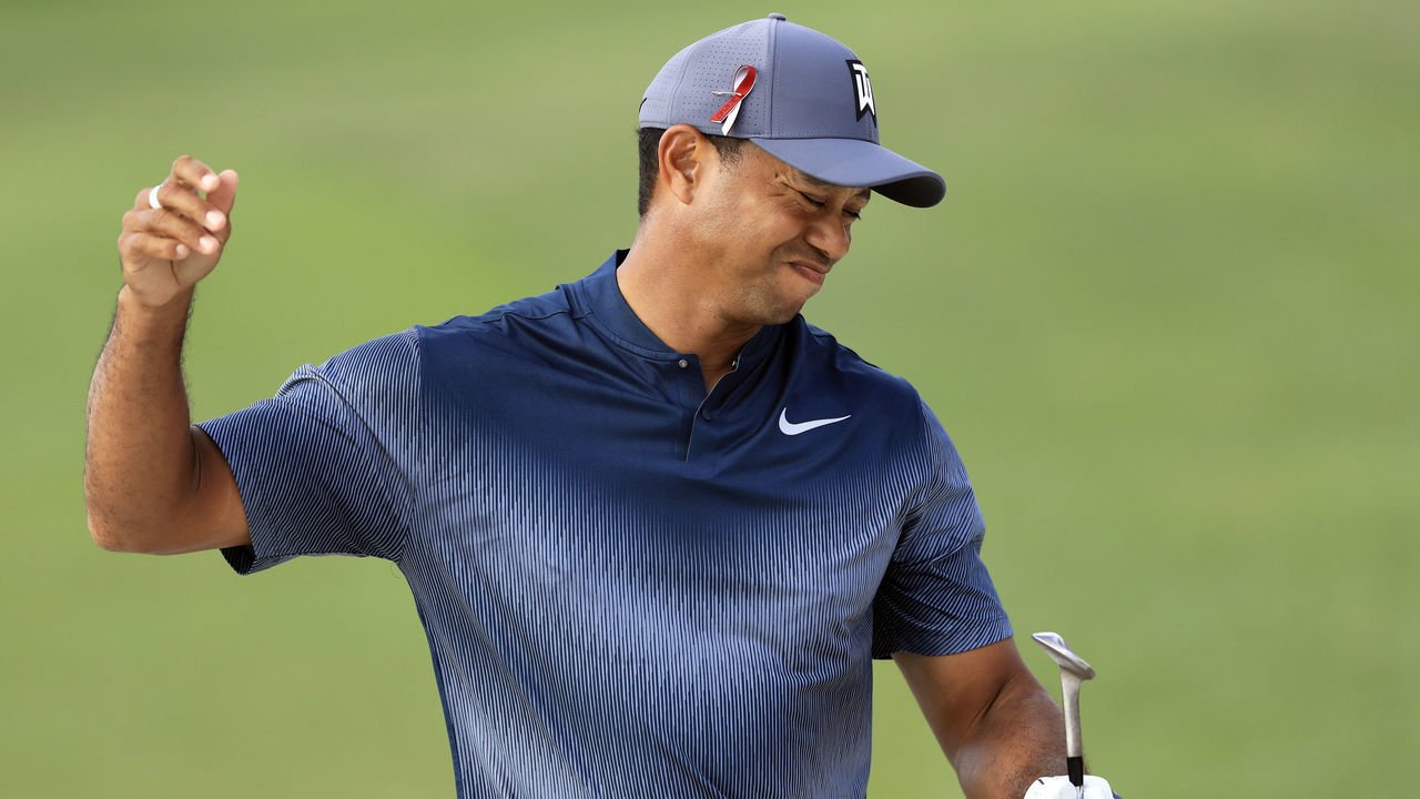 PALM BEACH GARDENS, FL - FEBRUARY 22: Tiger Woods reacts after a shot on the 18th hole during the first round of the Honda Classic at PGA National Resort and Spa on February 22, 2018 in Palm Beach Gardens, Florida.