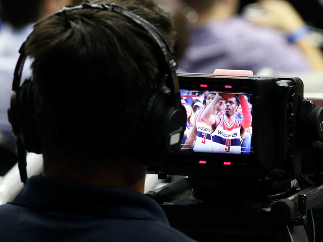 04 October, 2016: A camera man watches Washington Wizards guard Sheldon McClellan (9) take a foul shot during a preseason NBA game between the Washington Wizards and the Miami Heat at the Verizon Center in Washington D.C.