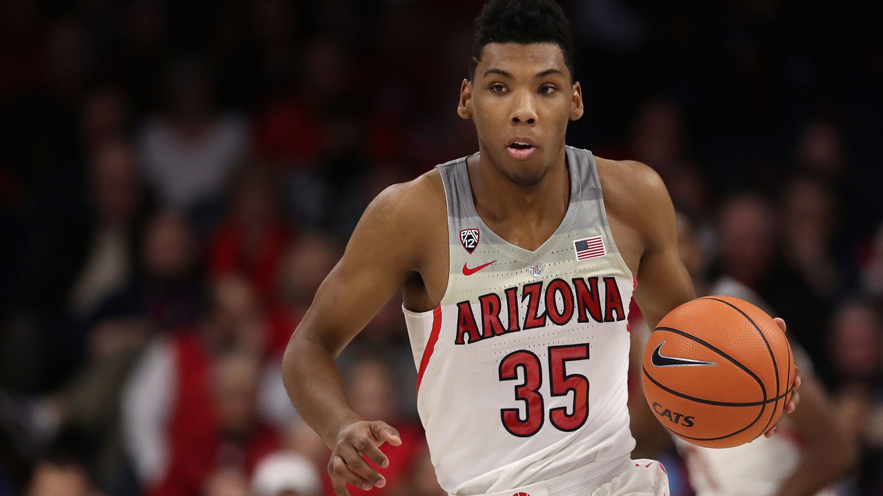 TUCSON, AZ - DECEMBER 21: Allonzo Trier #35 of the Arizona Wildcats handles the ball during the first half of the college basketball game against the Connecticut Huskies at McKale Center on December 21, 2017 in Tucson, Arizona. The Wildcats defeated the Huskies 73-58.