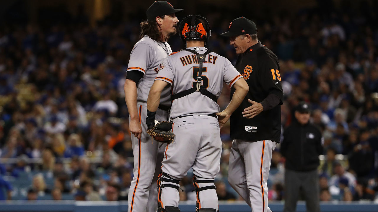 LOS ANGELES, CA - SEPTEMBER 22: Pitching coach Dave Righetti #19 of the San Francisco Giants visits the mound to talk with pitcher Jeff Samardzija #29 and catcher Nick Hundley #5 during the third inning of the MLB game against the Los Angeles Dodgers at Dodger Stadium on September 22, 2017 in Los Angeles, California.