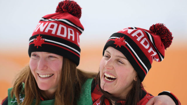 PYEONGCHANG-GUN, SOUTH KOREA - FEBRUARY 23: Kelsey Serwa (R) of Canada celebrates winning the gold medal with silver medallist Brittany Phelan of Canada during the victory ceremony for the Freestyle Skiing Ladies' Ski Cross Big Final on day fourteen of the PyeongChang 2018 Winter Olympic Games at Phoenix Snow Park on February 23, 2018 in Pyeongchang-gun, South Korea.