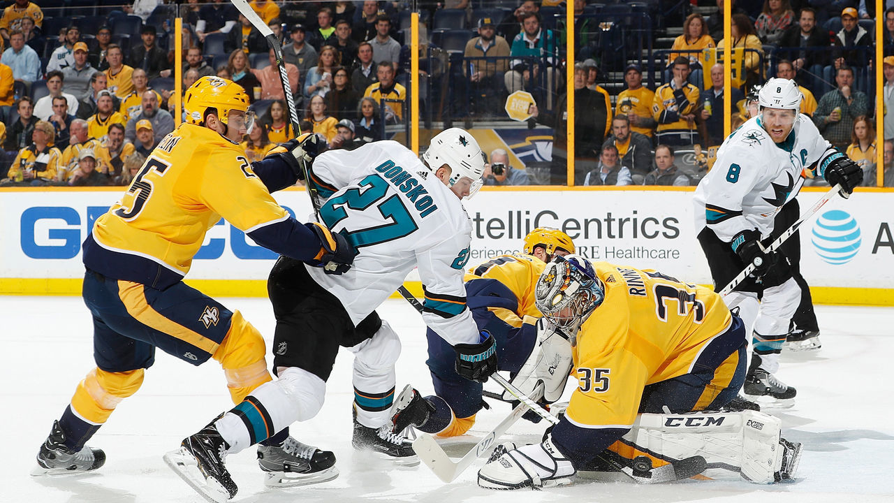 NASHVILLE, TN - FEBRUARY 22: Pekka Rinne #35 of the Nashville Predators makes the save against Joonas Donskoi #27 of the San Jose Sharks as Alexei Emelin #25 defends during an NHL game at Bridgestone Arena on February 22, 2018 in Nashville, Tennessee.