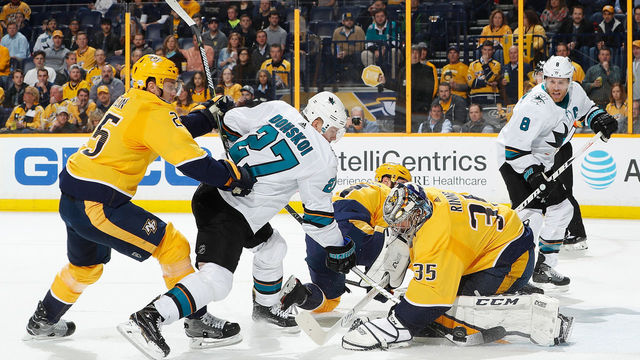 NASHVILLE, TN - FEBRUARY 22: Pekka Rinne #35 of the Nashville Predators makes the save against Joonas Donskoi #27 of the San Jose Sharks as Alexei Emelin #25 defends during an NHL game at Bridgestone Arena on February 22, 2018 in Nashville, Tennessee.