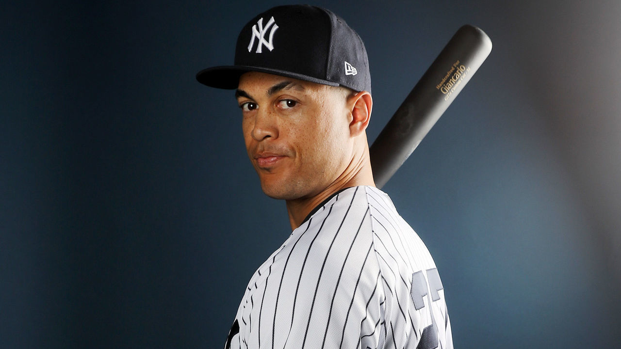 TAMPA, FL - FEBRUARY 21: Giancarlo Stanton #27 of the New York Yankees poses for a portrait during the New York Yankees photo day on February 21, 2018 at George M. Steinbrenner Field in Tampa, Florida.