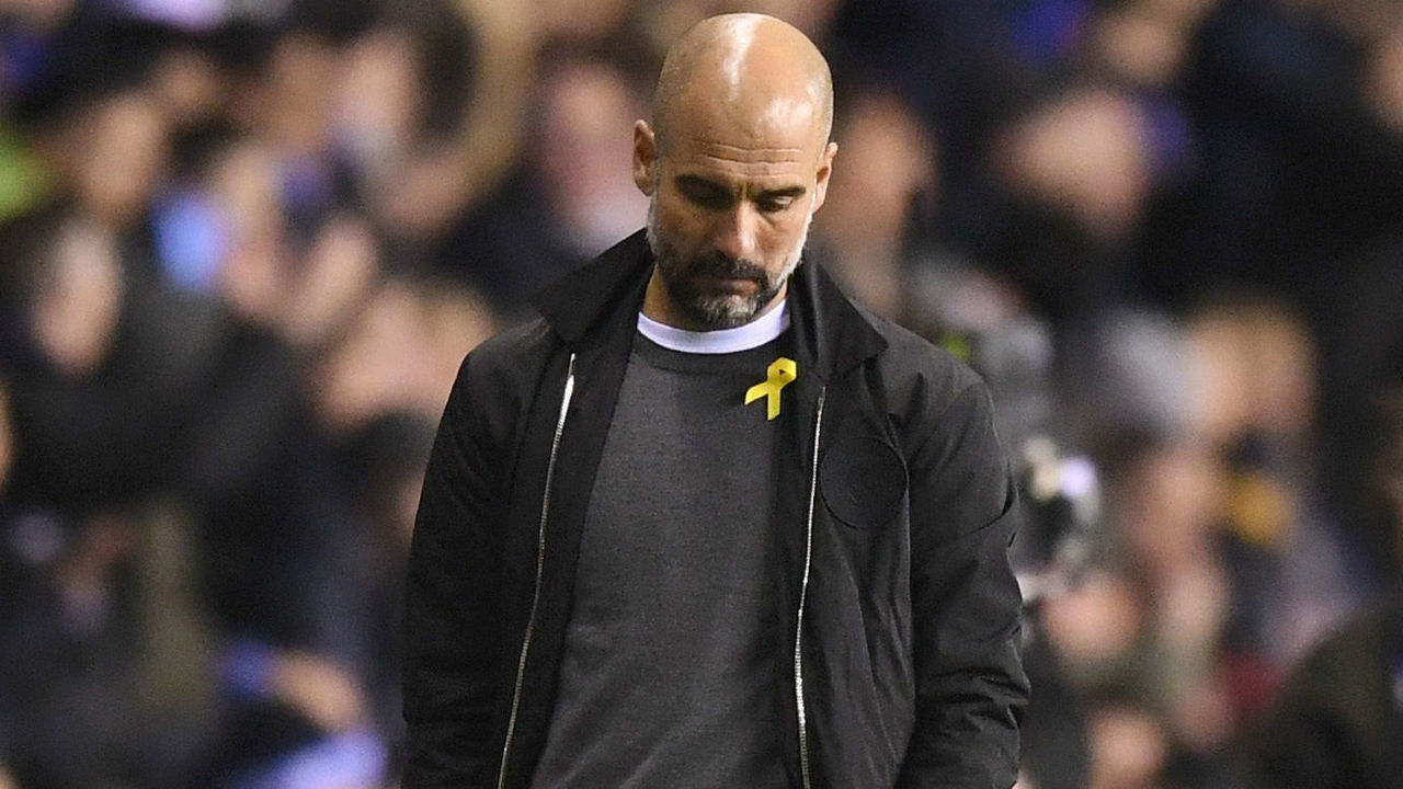 WIGAN, ENGLAND - FEBRUARY 19: Josep Guardiola, Manager of Manchester City looks dejected during the Emirates FA Cup Fifth Round match between Wigan Athletic and Manchester City at DW Stadium on February 19, 2018 in Wigan, England.