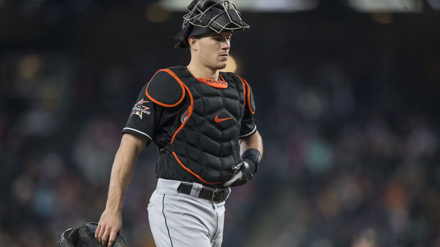SEATTLE, WA - APRIL 19: Catcher J.T. Realmuto #11 of the Miami Marlins walks back to home plate during a game Seattle Mariners at Safeco Field on April 19, 2017 in Seattle, Washington. The Mariners won 10-5.
