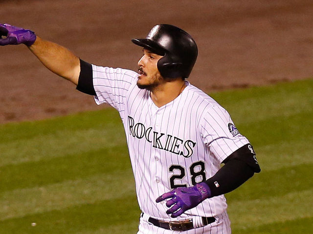 DENVER, CO - AUGUST 29: Nolan Arenado #28 of the Colorado Rockies celebrates his three run home run during the seventh inning of an interleague game against the Detroit Tigers at Coors Field on August 29, 2017 in Denver, Colorado.
