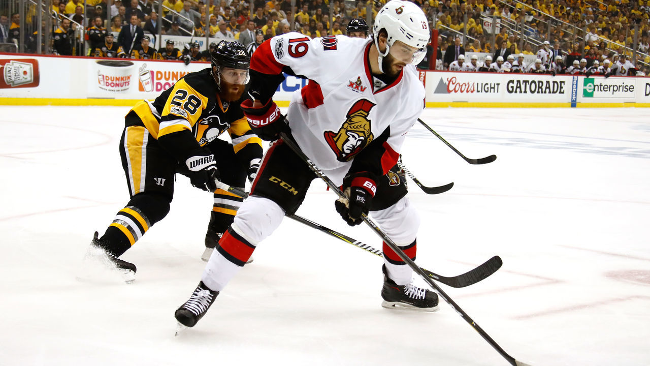 PITTSBURGH, PA - MAY 21: Derick Brassard #19 of the Ottawa Senators skates with the puck against Ian Cole #28 of the Pittsburgh Penguins in Game Five of the Eastern Conference Final during the 2017 NHL Stanley Cup Playoffs at PPG PAINTS Arena on May 21, 2017 in Pittsburgh, Pennsylvania.