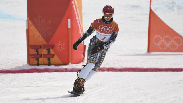 Czech Republic's Ester Ledecka finishes first in a semi-final heat of the women's snowboard parallel giant slalom event at the Phoenix Park during the Pyeongchang 2018 Winter Olympic Games on February 24, 2018 in Pyeongchang. / AFP PHOTO / LOIC VENANCE